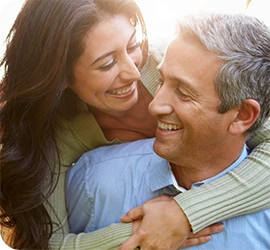 couple embracing and smiling